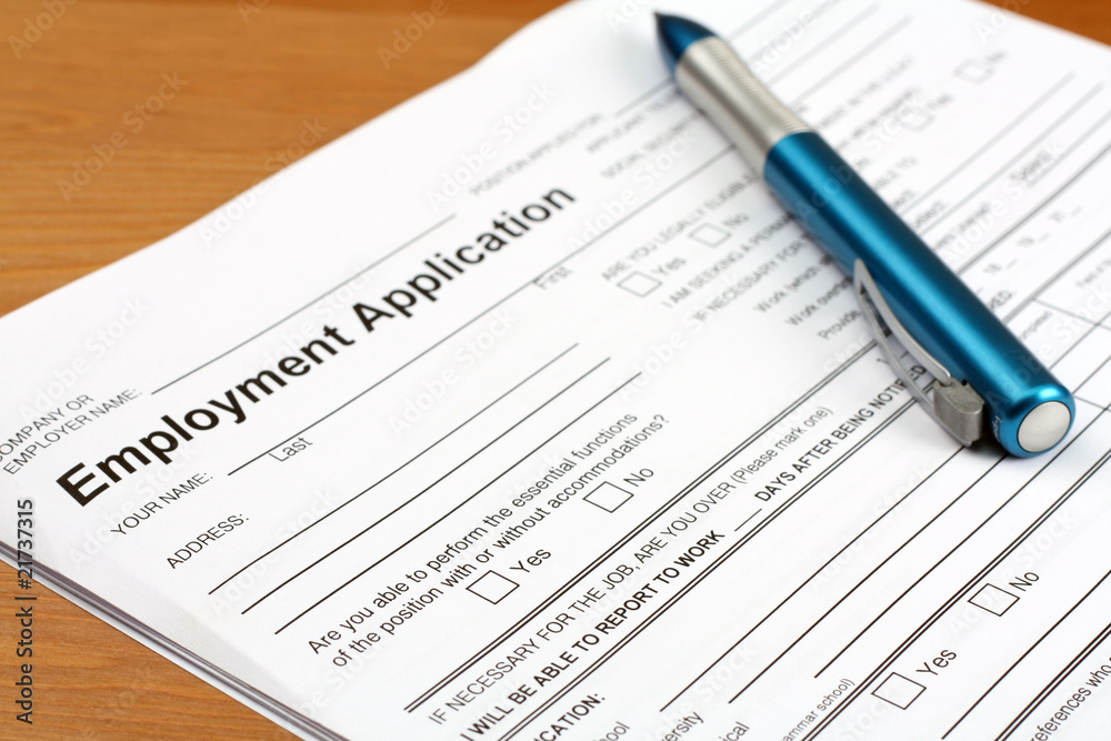 Employment Application Form on desk Employment Application Form on desk