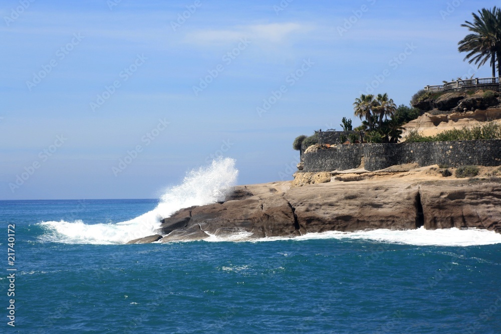 Wave crash over rock coast