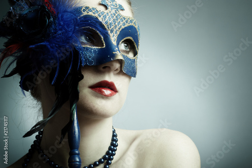 The beautiful young girl in a mysterious mask