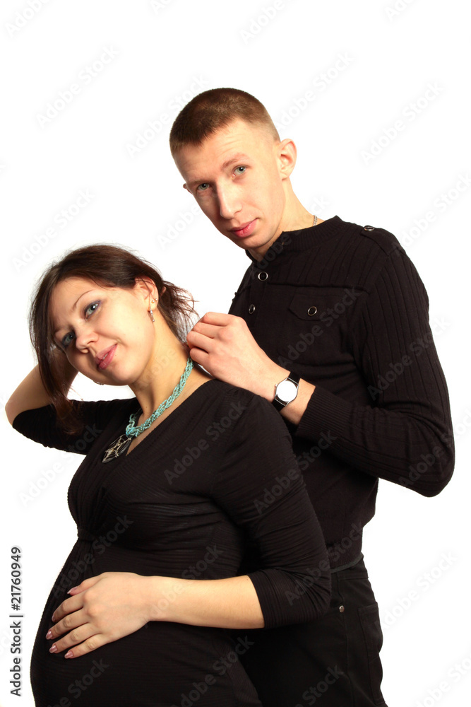 beautiful smiling pregnant woman and a happy man