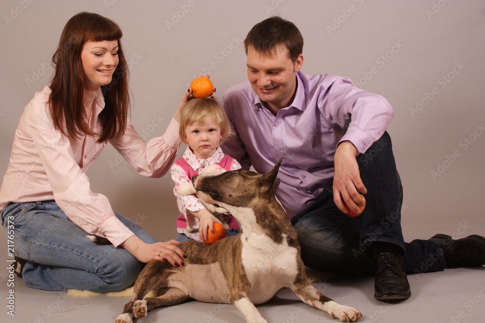 Obraz premium young beautiful family with dog