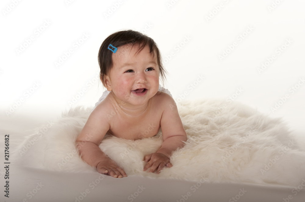 Pacific Islander baby girl learning to crawl Pacific Islander baby girl learning to crawl
