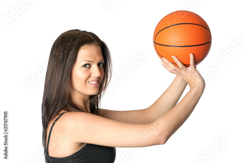 Attractive girl shooting basketball