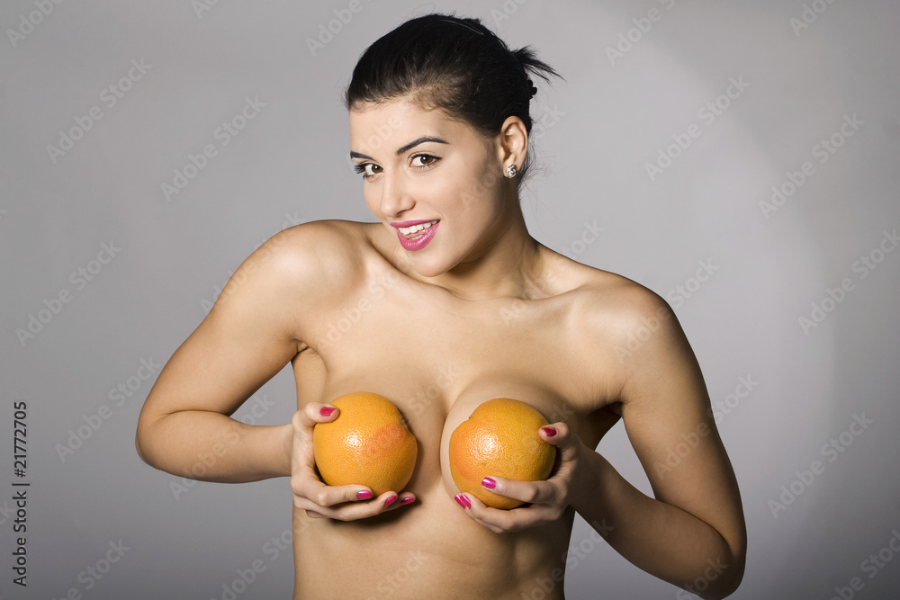 Part of photo series. Woman with grapefruit slices
