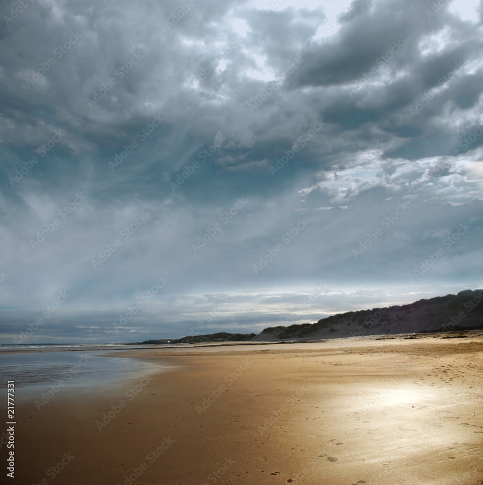 Stormy beach with dark clouds