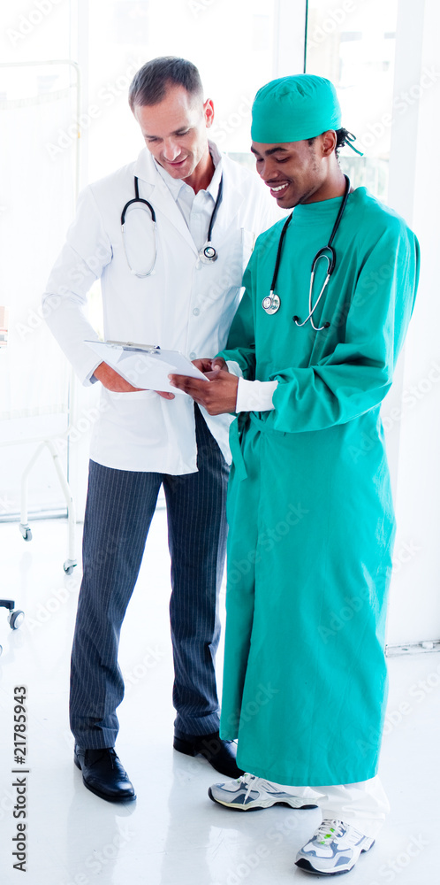 Two concentrated male doctors at work Two concentrated male doctors at work