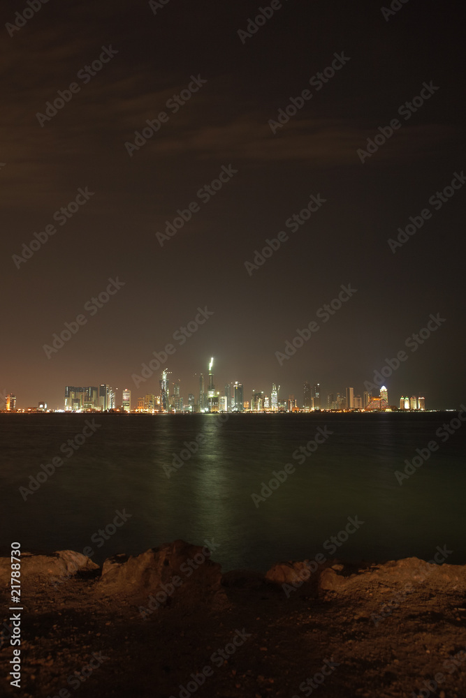 The night skyline over the persian gulf of the city of Doha