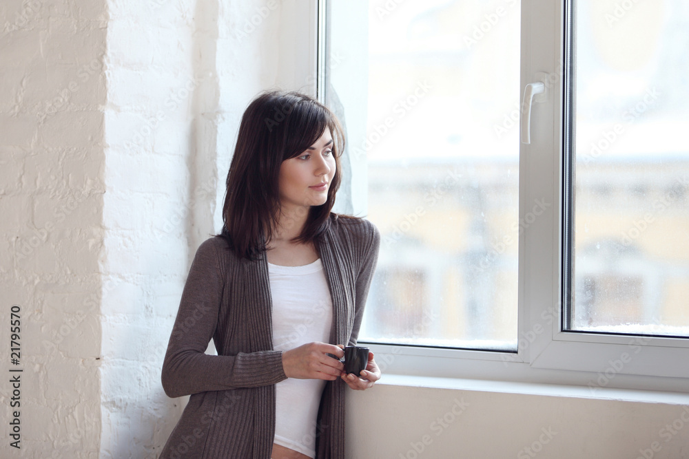 girl looks out of the window girl looks out of the window