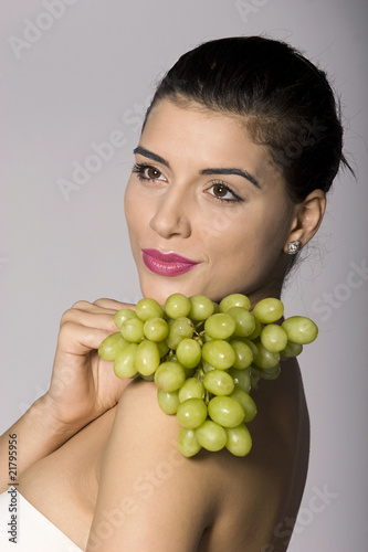 Woman with fresh green grapes