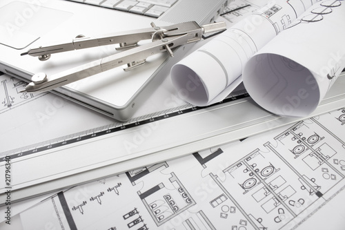 Architectural plans and blueprints in office