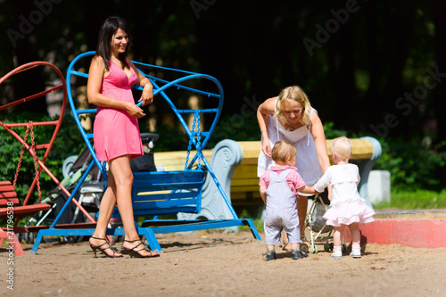 Mothers playing with children
