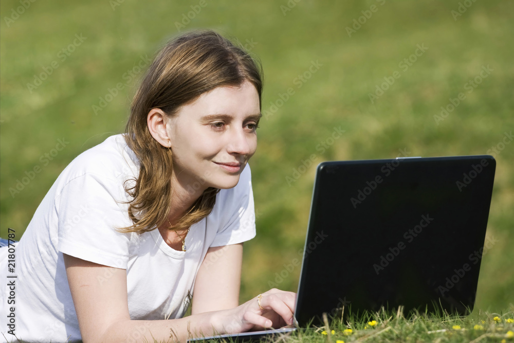 Young casual woman working on laptop outdoor Young casual woman working on laptop outdoor