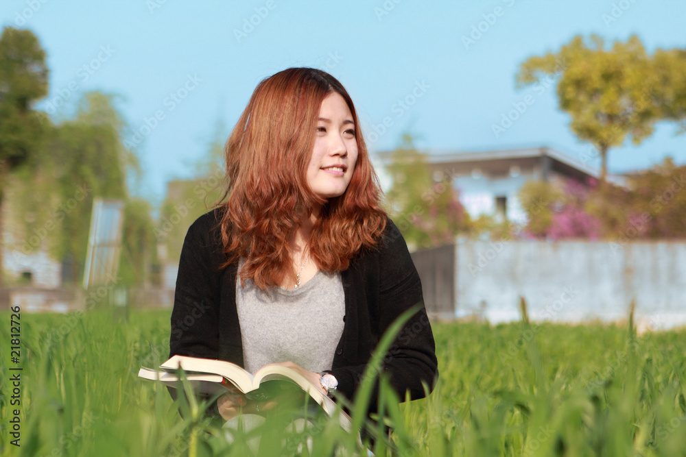 young asian girl reading outdoor young asian girl reading outdoor