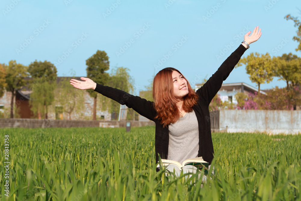 asian girl relaxing outdoor with book asian girl relaxing outdoor with book