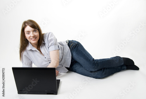 lying with laptop