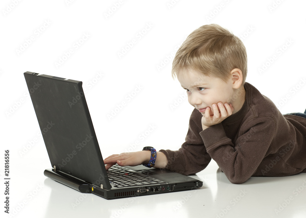 4 year old boy looking at his computer