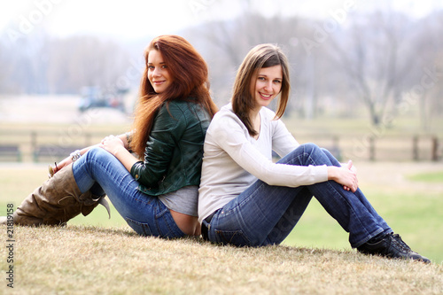 happy young women on field in summer