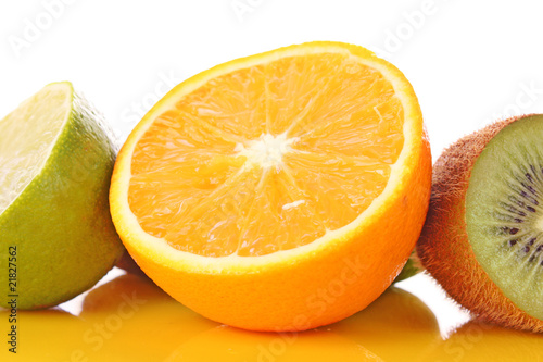 Orange and other fruits on yellow