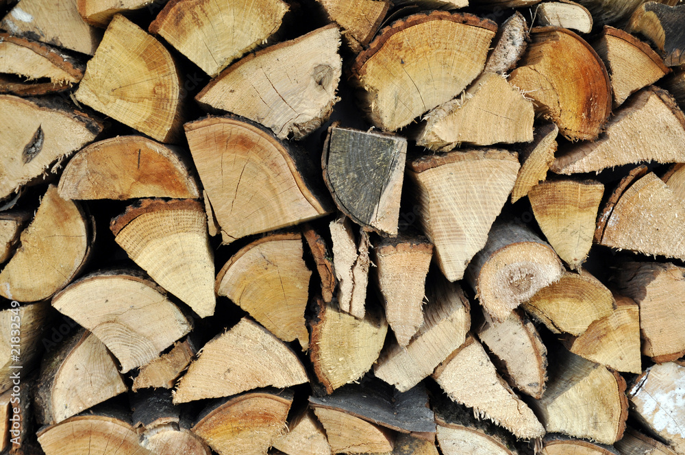 Logs stacked to be used as firewood Logs stacked to be used as firewood
