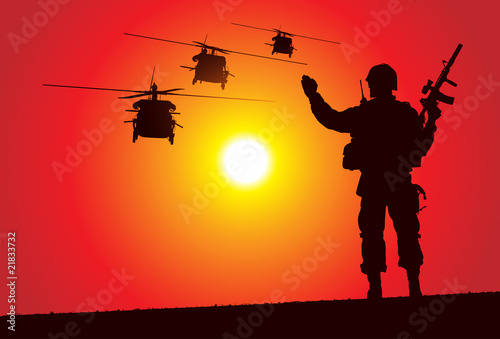 Silhouette of a soldier with helicopters on the background