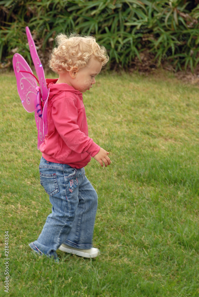 Blondie litlle girl in a butterfly costume wings Blondie litlle girl in a butterfly costume wings