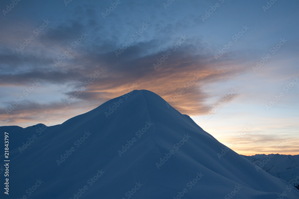 blue mountain under orange cloud