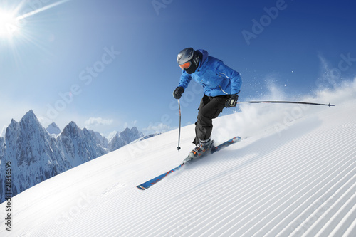 Skier in high mountains photo
