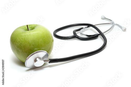 Obraz na plátně Stethoscope and apple patient (allegorical). Isolated on the whi