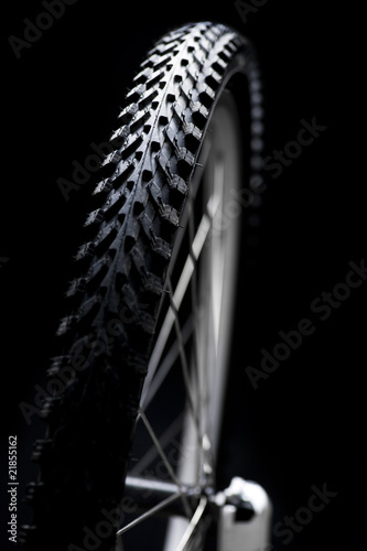 bicycle tyre on black background