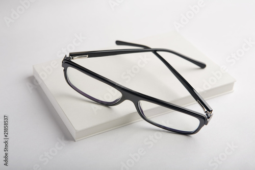 Glasses on a white book