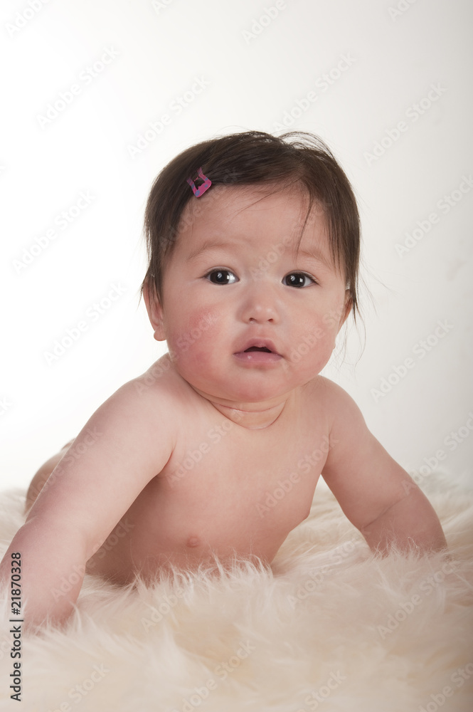 Pacific Islander baby girl learning to crawl Pacific Islander baby girl learning to crawl