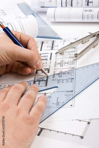 Architectural plans and blueprints in office