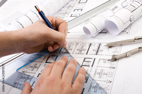 Architectural plans and blueprints in office