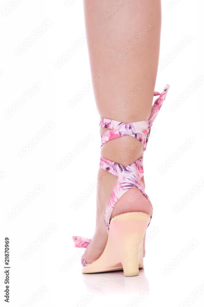 Sexy legs in pink shoes on a white background Sexy legs in pink shoes on a white background