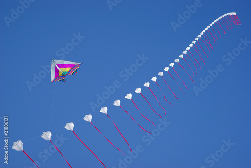 Kites flying in blue sky