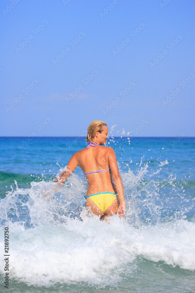 woman on the beach in Greece