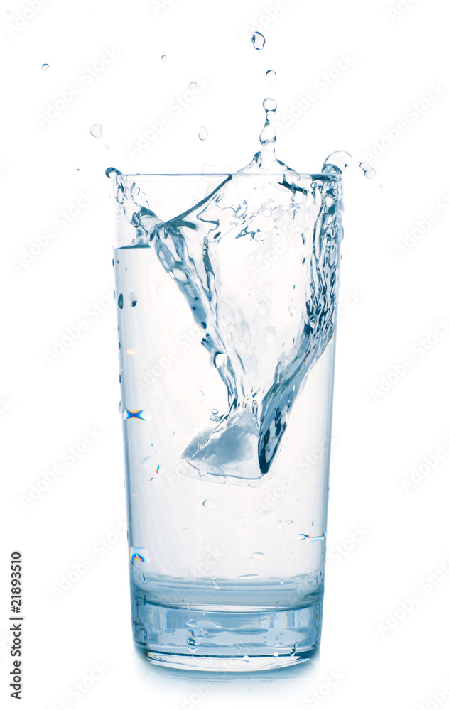 splash in water glass isolated on white splash in water glass isolated on white