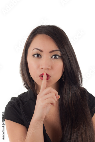 Studio shot of beautiful sexy young asian woman with finger to l