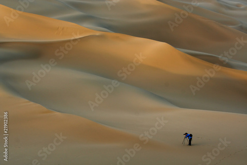 photographer in sand desert