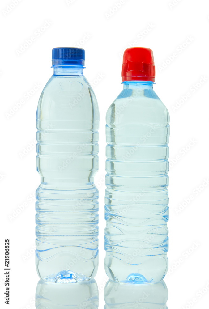 Bottles of mineral water reflected on white background Bottles of mineral water reflected on white background