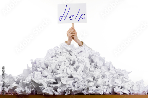 Person in pile of papers