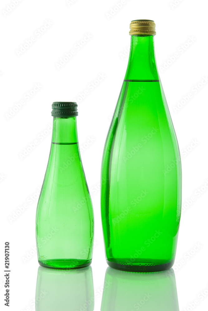 Bottles of mineral water reflected on white background Bottles of mineral water reflected on white background