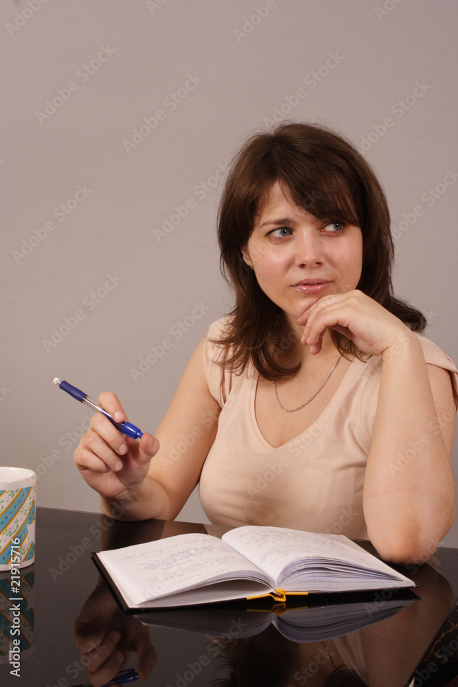 young beautiful woman writing in her diary young beautiful woman writing in her diary