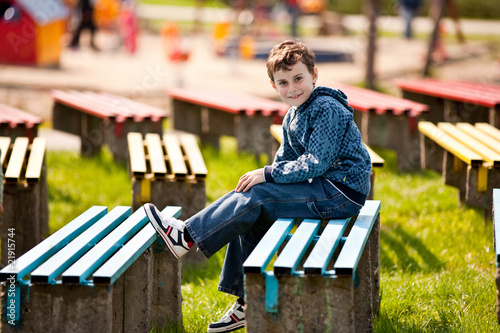 Cute schoolboy in a park