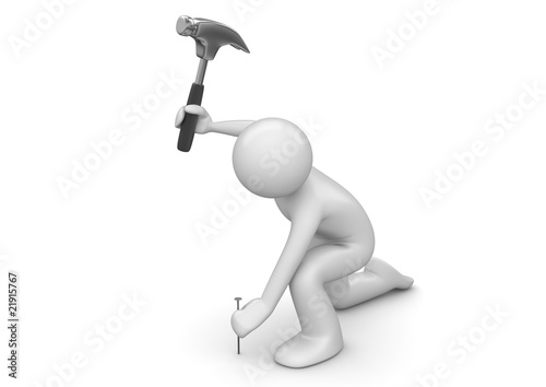 Fototapeta Naklejka Na Ścianę i Meble -  Man hammers in the nail