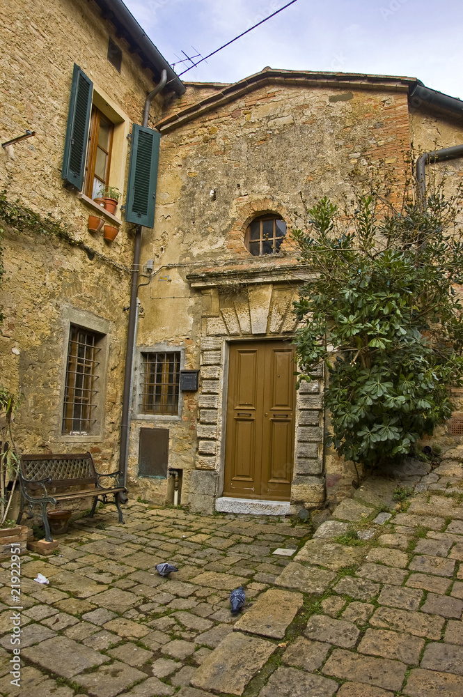 a narrow street in Volterra, Tuscany, Italy