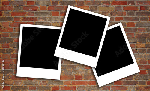 brick wall texture with polaroids