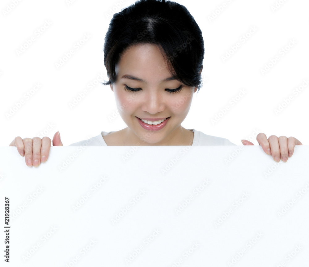 Portrait of an attractive woman holding billboard Portrait of an attractive woman holding billboard