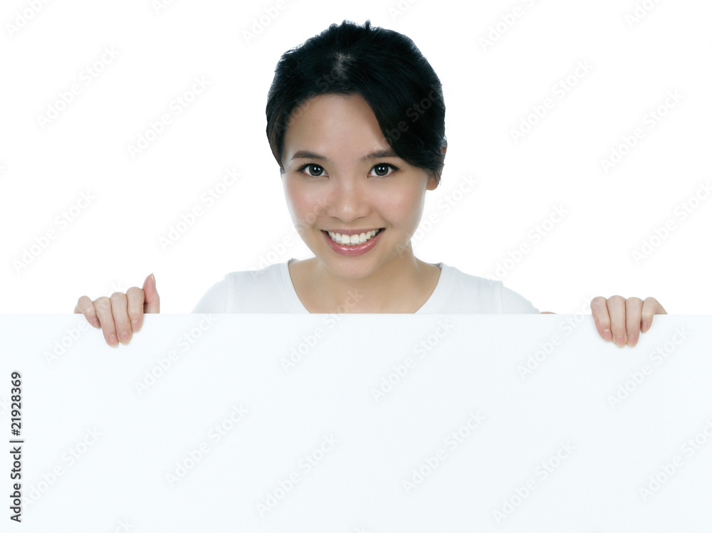 Closeup of an attractive woman holding billboard Closeup of an attractive woman holding billboard