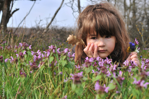 Pretty girl relaxing on the grass